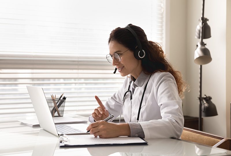 Doctor on video call with patient.